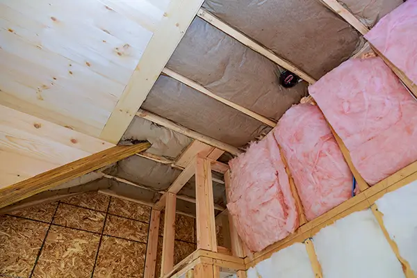 insulation being applied in an attic